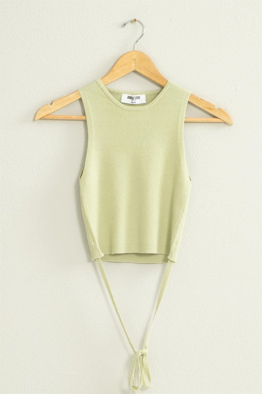 green tank with strings hanging on hanger
